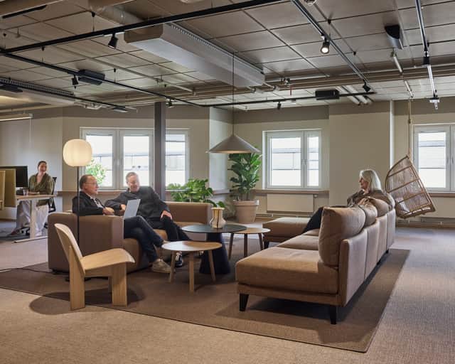 Three people having an meeting.
