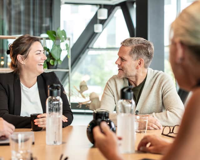 Three people having an meeting.